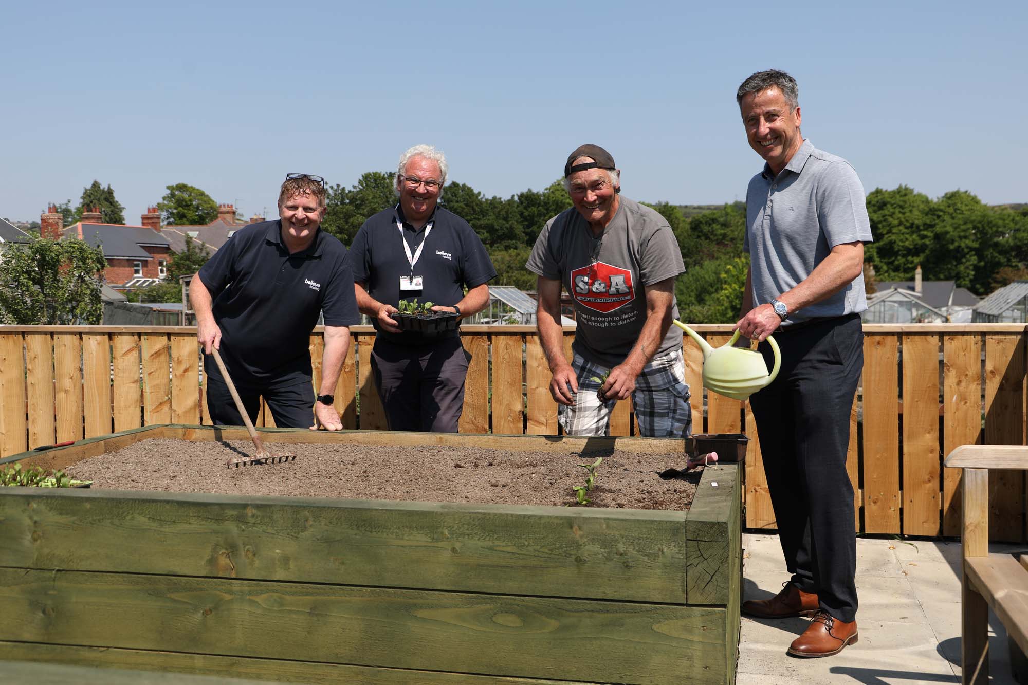 believe housing and partners help community garden bloom into life ...